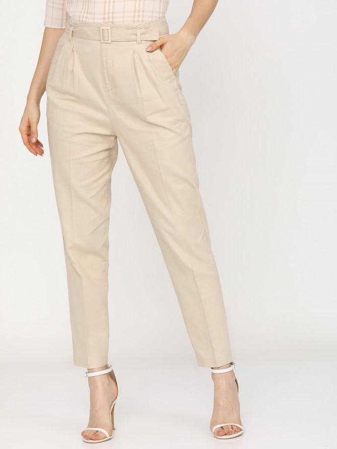 Buy Tokyo Talkies Beige Pleated Tapered Fit Trousers for Women Online ...