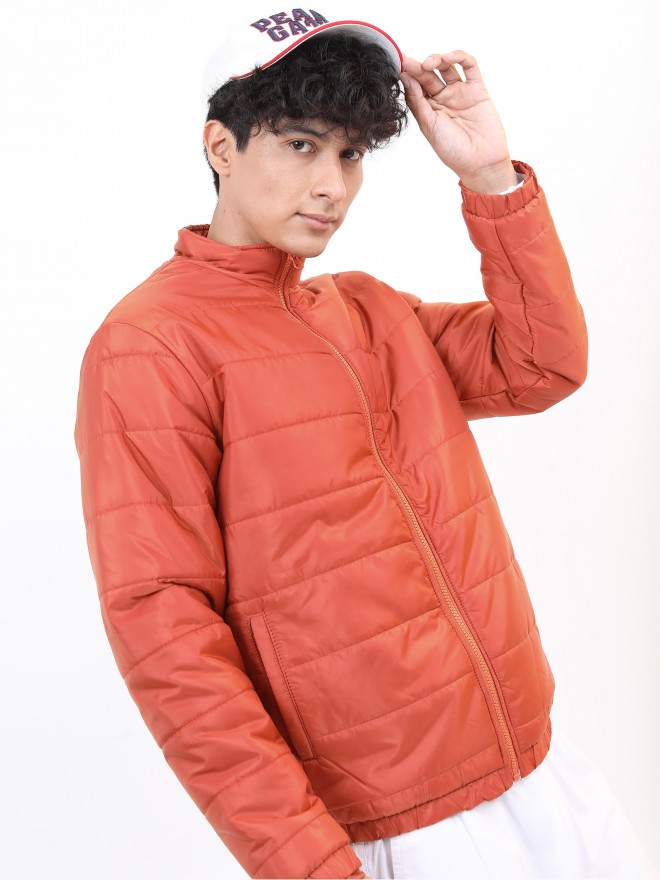 A Man in Orange Puffer Jacket · Free Stock Photo