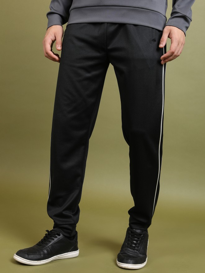 Buy online Black Solid Straight Tapered Pant from Skirts, tapered